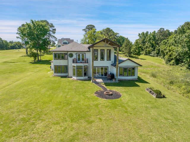 a view of swimming pool with an outdoor space and seating area