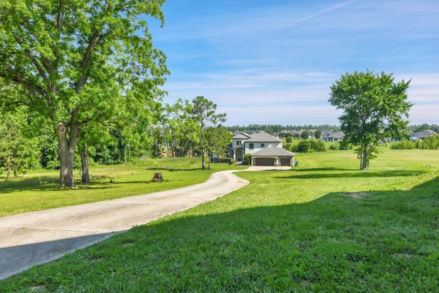 a room with wooden floor and glass door