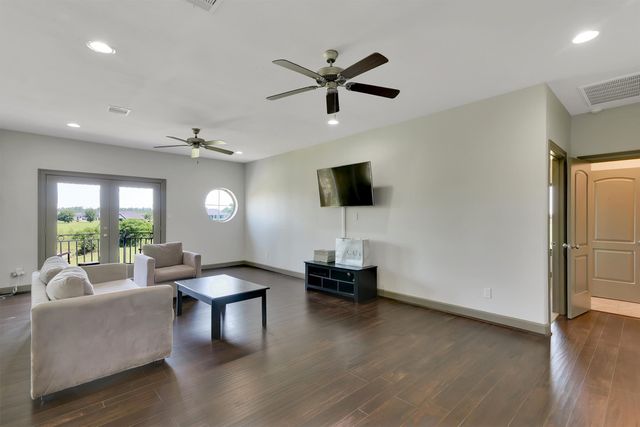 a kitchen with granite countertop a sink stainless steel appliances and cabinets