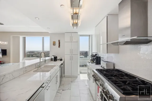 a view of a livingroom with furniture and a flat screen tv