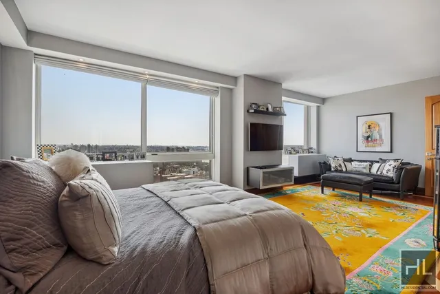 a bed room with a bed and a night stand