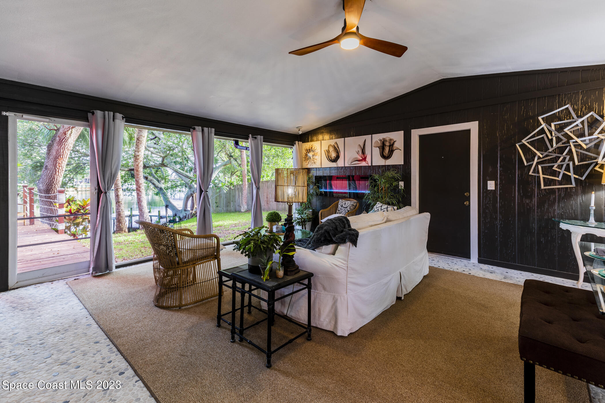 1428 Rose Court Melbourne, FL 32935 - Photo 11 of 78 a living room with furniture and a large window