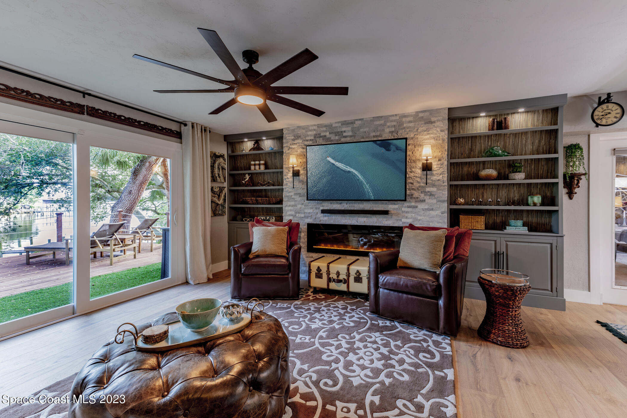 1428 Rose Court Melbourne, FL 32935 - Photo 18 of 78 a living room with furniture and a flat screen tv