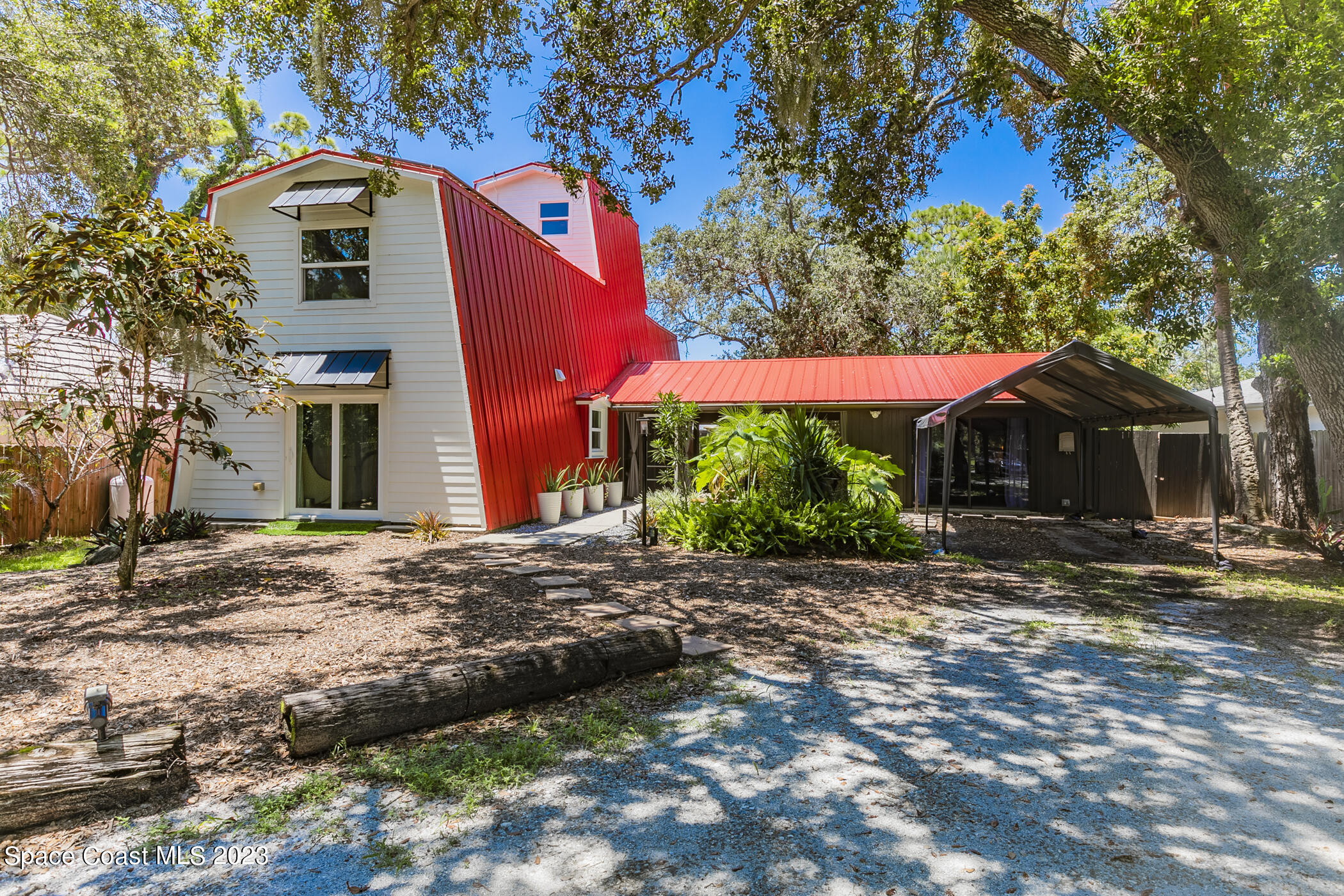 1428 Rose Court Melbourne, FL 32935 - Photo 2 of 78 a front view of a house with a yard