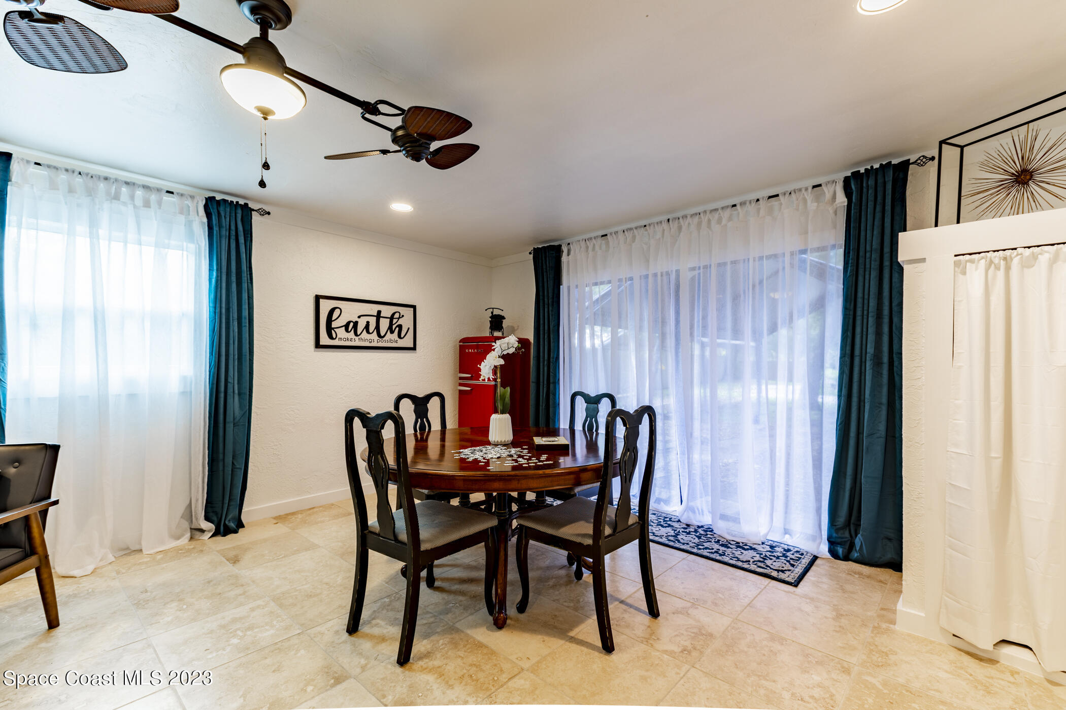 1428 Rose Court Melbourne, FL 32935 - Photo 37 of 78 a view of a dining room with furniture