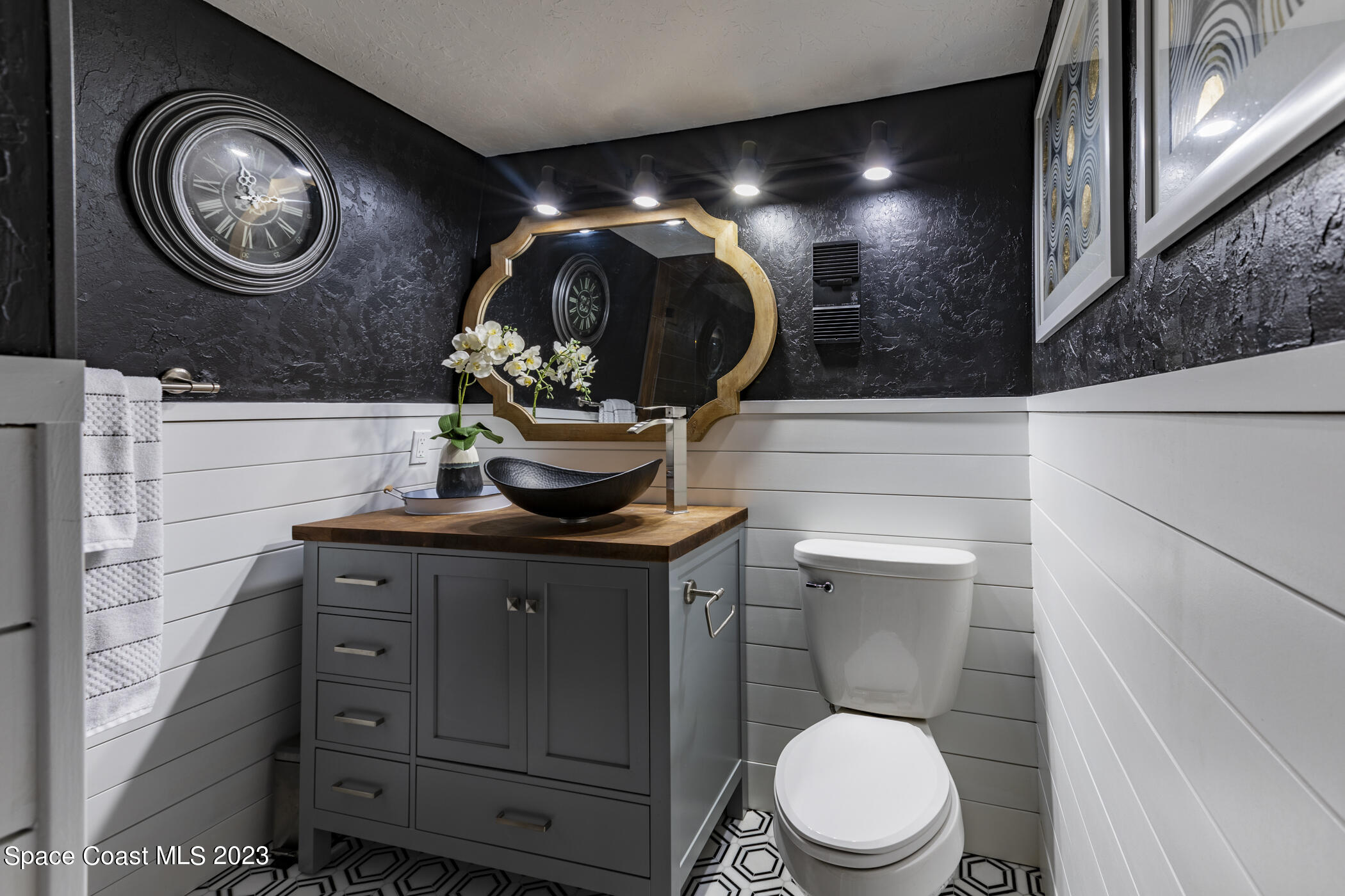 1428 Rose Court Melbourne, FL 32935 - Photo 40 of 78 a bathroom with a toilet and a sink