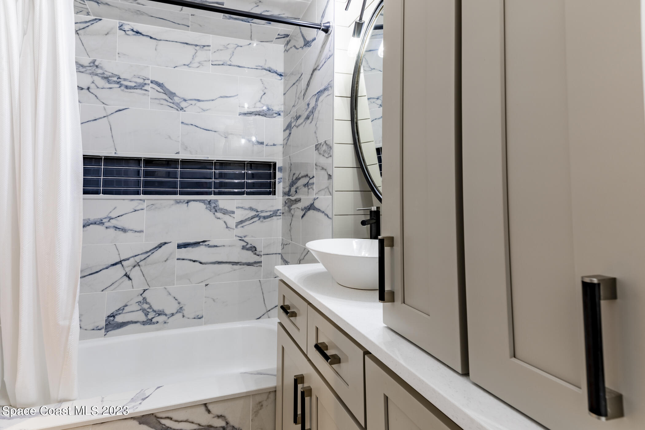1428 Rose Court Melbourne, FL 32935 - Photo 51 of 78 a bathroom with a bathtub and shower