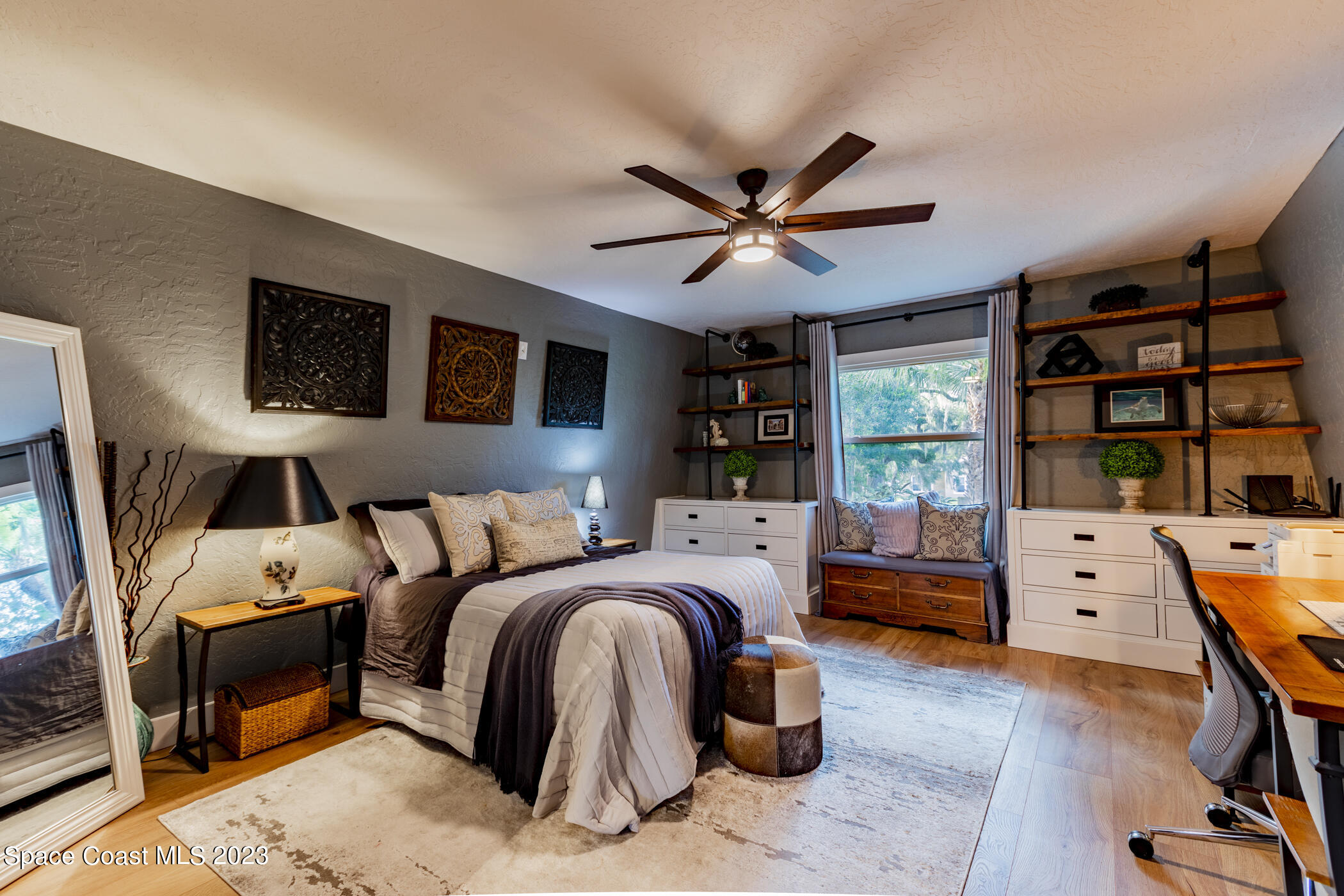 1428 Rose Court Melbourne, FL 32935 - Photo 55 of 78 a bed room with a bed window and a flat screen tv