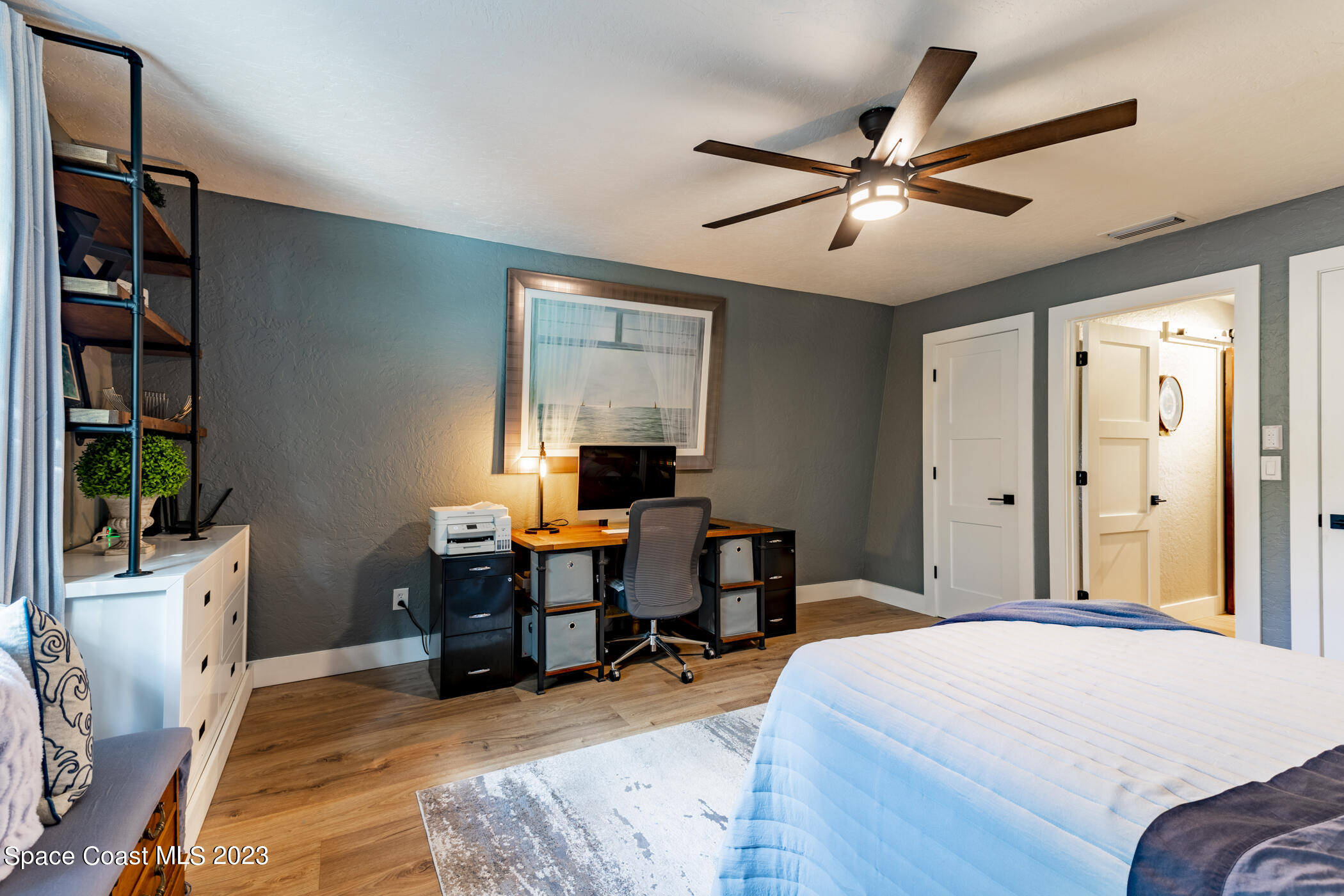 1428 Rose Court Melbourne, FL 32935 - Photo 56 of 78 a bedroom with a workspace