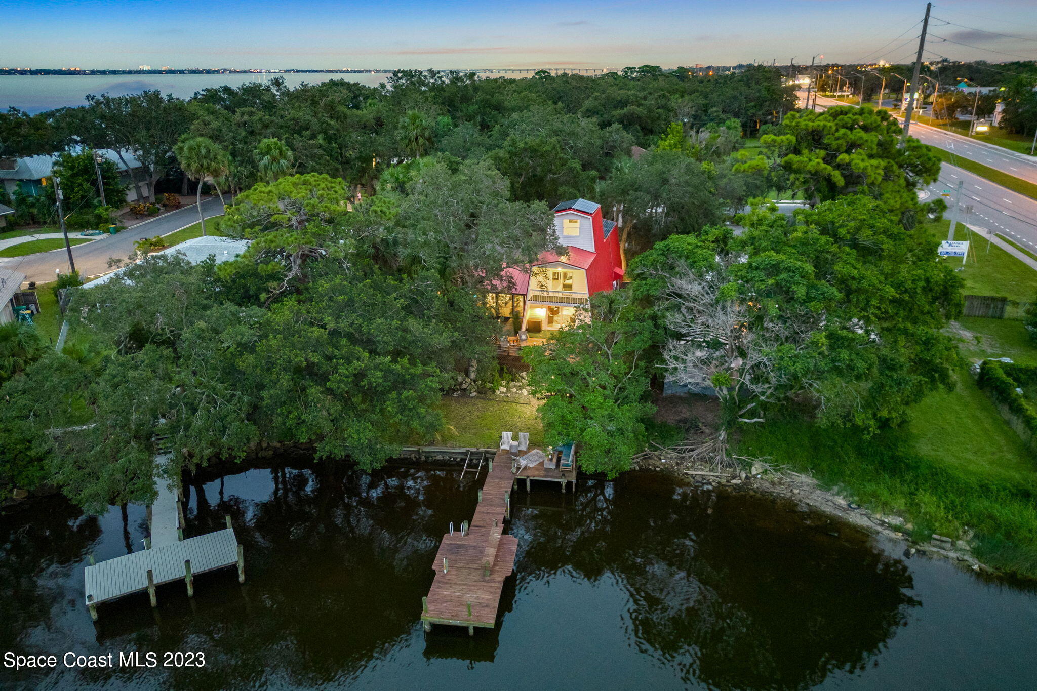 1428 Rose Court Melbourne, FL 32935 - Photo 6 of 78 a picture of street view with lots of trees