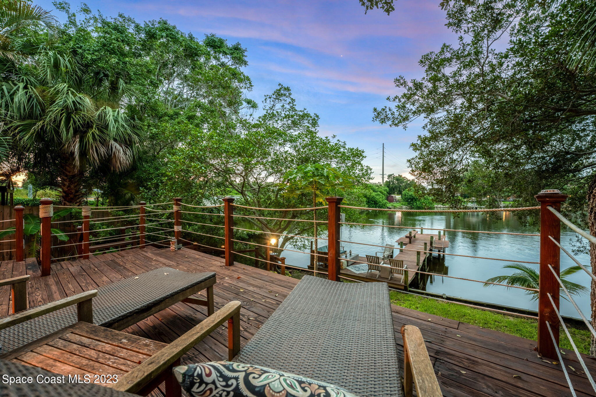 1428 Rose Court Melbourne, FL 32935 - Photo 68 of 78 a view of a balcony with wooden floor and outdoor seating