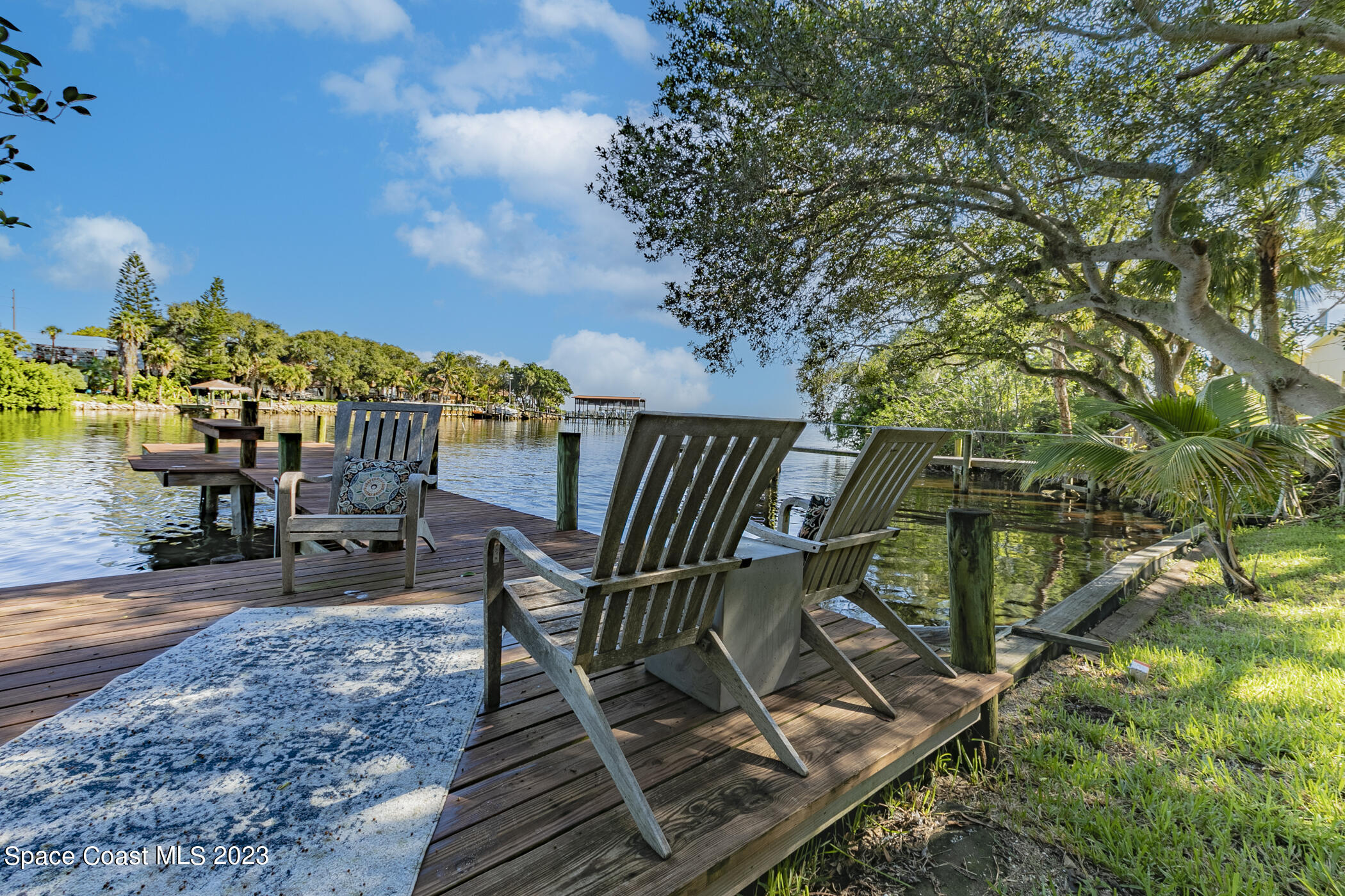 1428 Rose Court Melbourne, FL 32935 - Photo 72 of 78 a view of a chairs and table on the wooden floor