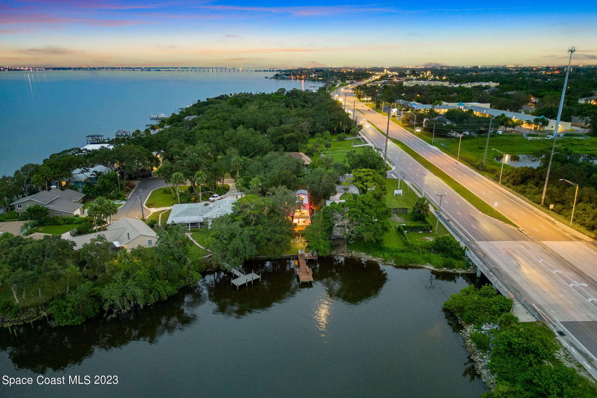 1428 Rose Court Melbourne, FL 32935 - Photo 76 of 78 Twilight Aerial Back