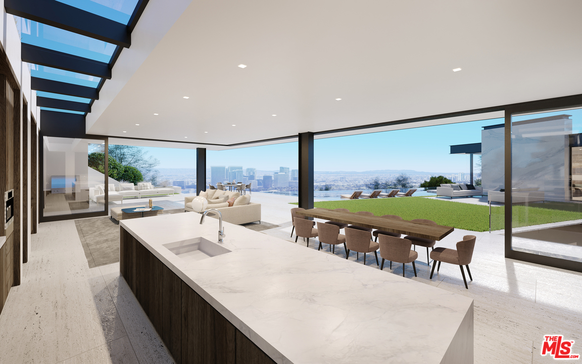 1200 Laurel Way Beverly Hills, CA 90210 - Photo 12 of 16 a living room with chairs and a table