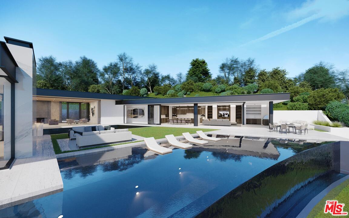 1200 Laurel Way Beverly Hills, CA 90210 - Photo 15 of 16 a view of house with swimming pool and outdoor seating