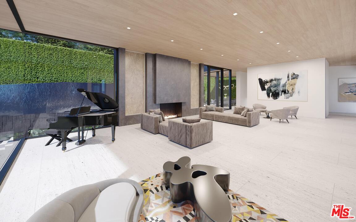 1200 Laurel Way Beverly Hills, CA 90210 - Photo 10 of 16 a living room with furniture and a large window