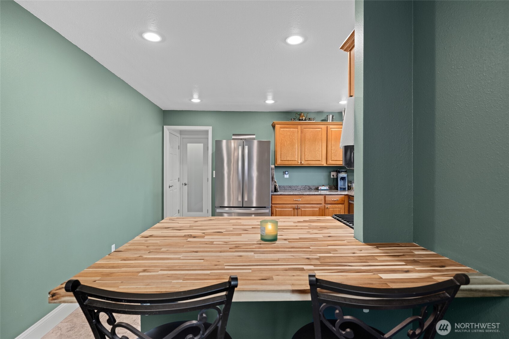 415 Sterling Street Sedro-Woolley, WA 98284 - Photo 17 of 38 a room with a table chairs and wooden floor