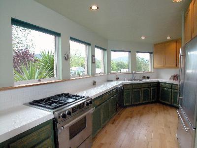 6293 Montana Road Santa Rosa, CA 95409 - Photo 3 of 9 a kitchen with stainless steel appliances a stove sink and cabinets