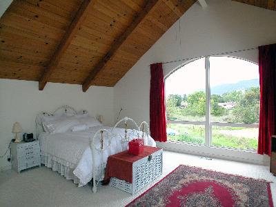 6293 Montana Road Santa Rosa, CA 95409 - Photo 5 of 9 a bedroom with a bed and large window