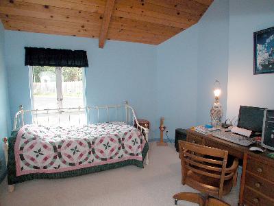 6293 Montana Road Santa Rosa, CA 95409 - Photo 8 of 9 a bedroom with a bed and a window