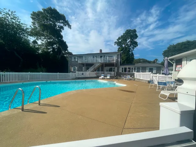 a view of a swimming pool with a patio