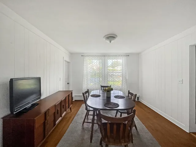 a view of a dining room with furniture window and outside view