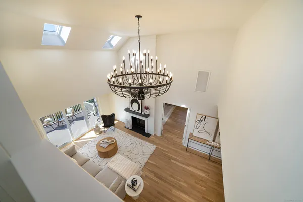 a view of a dining room with furniture and chandelier