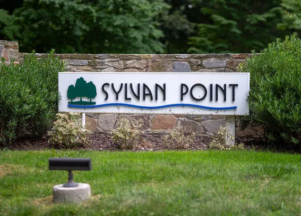 a view of sign board with green field