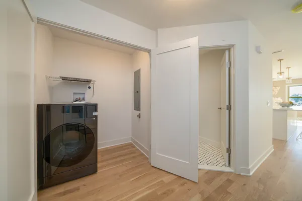 a view of a hallway with washer and dryer