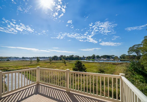 a view of a balcony with lake view and mountain view
