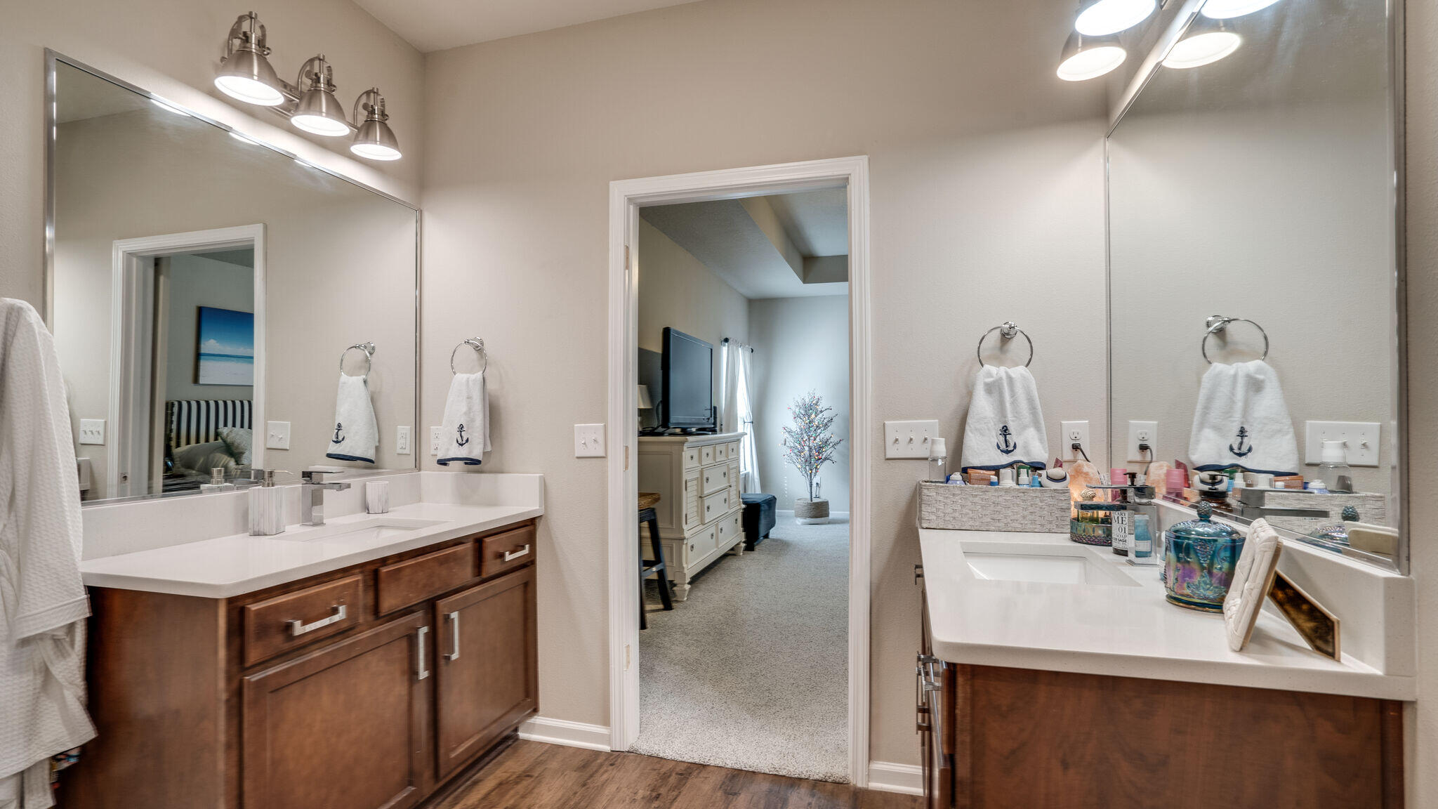 260 Cornelia Street Freeport, FL 32439 - Photo 15 of 42 a bathroom with double vanity sinks a vanity and a mirror