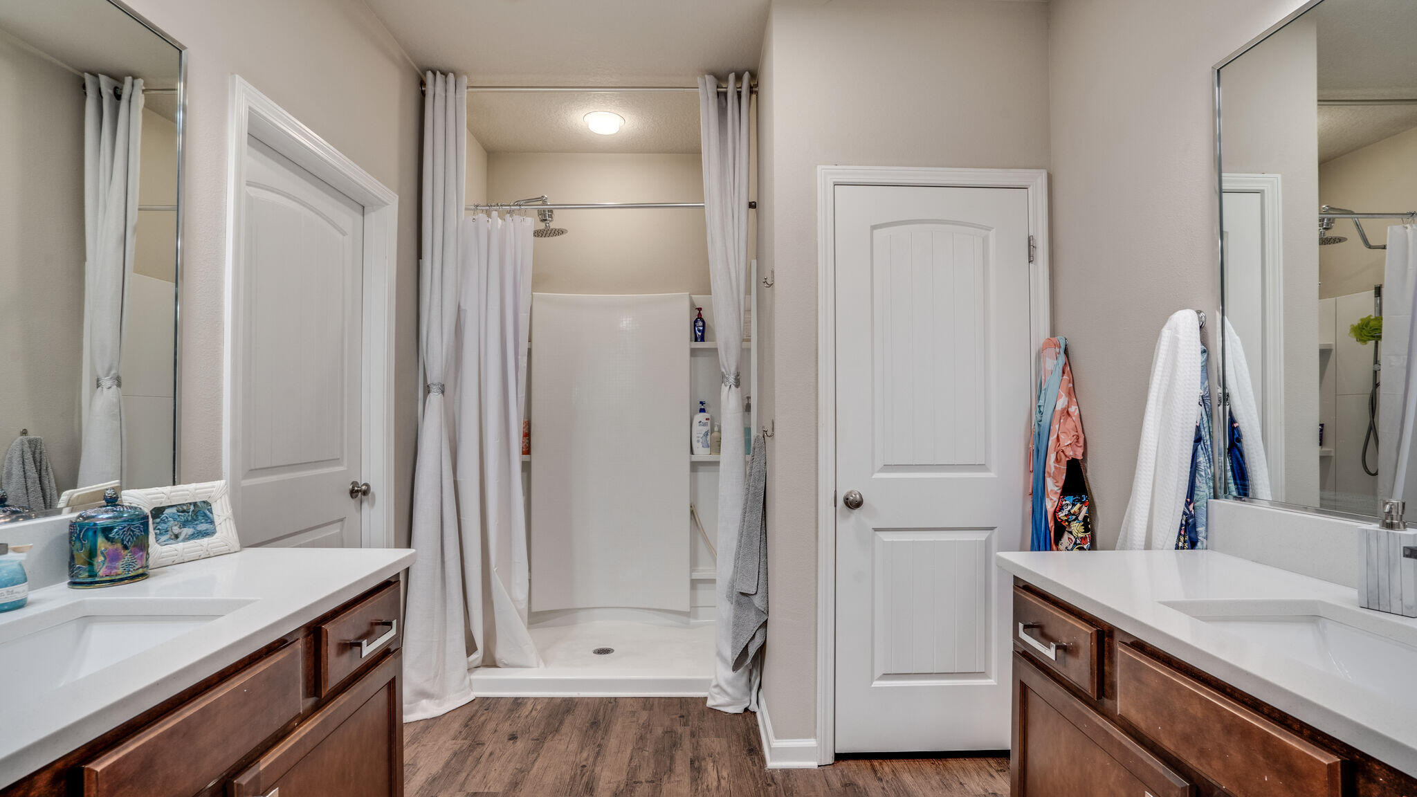 260 Cornelia Street Freeport, FL 32439 - Photo 16 of 42 a bathroom with a sink vanity granite tub shower and a mirror