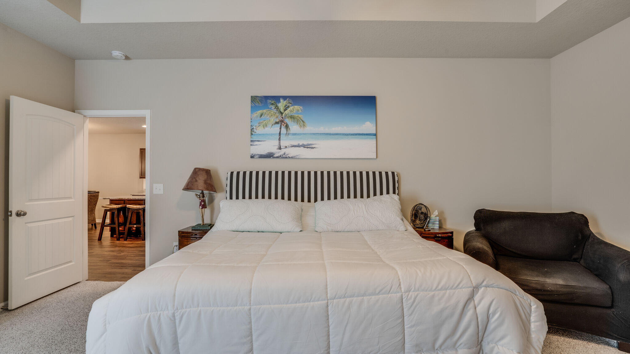 260 Cornelia Street Freeport, FL 32439 - Photo 18 of 42 a bedroom with a bed and a chair