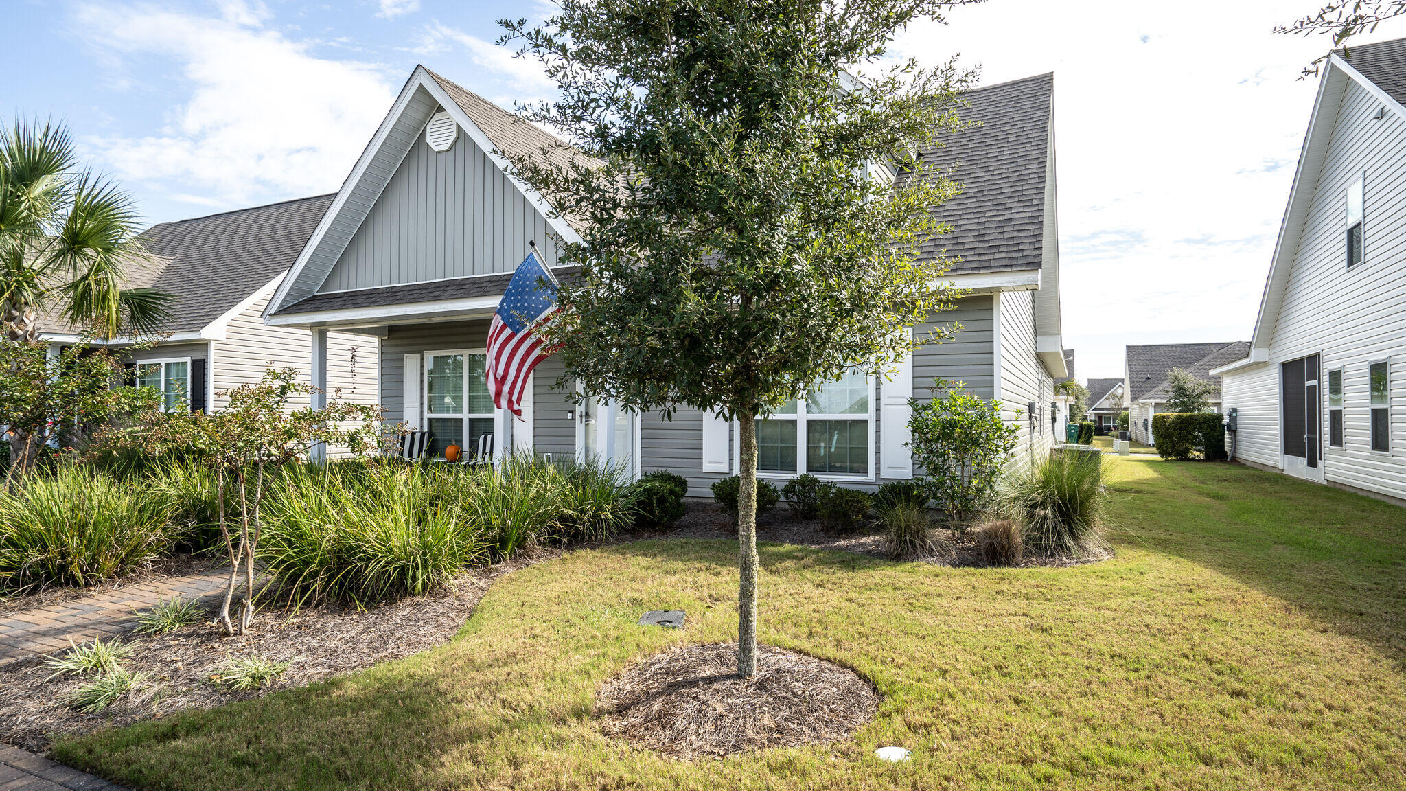 260 Cornelia Street Freeport, FL 32439 - Photo 2 of 42 a front view of a house with a yard