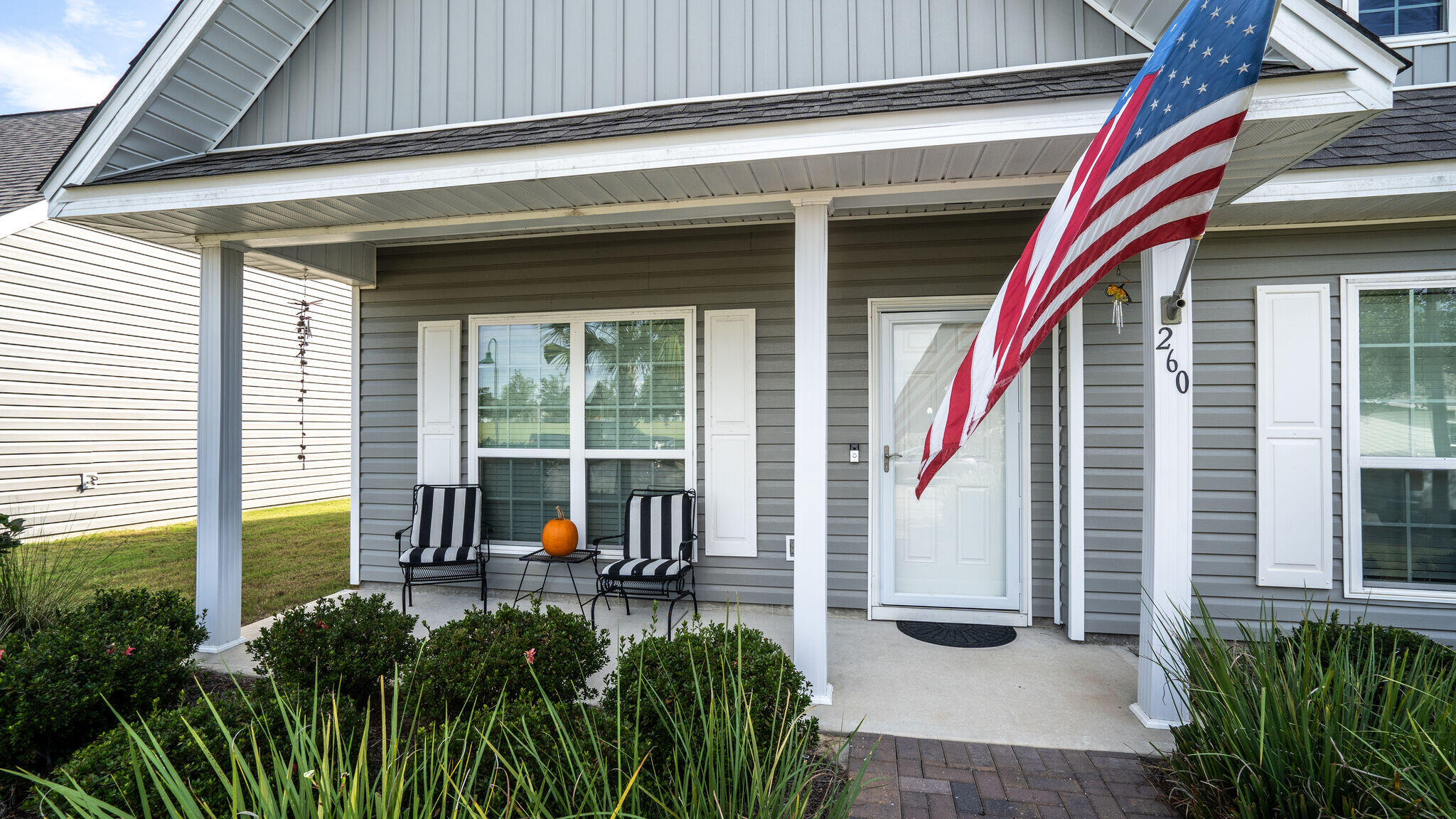 260 Cornelia Street Freeport, FL 32439 - Photo 3 of 42 a view of a house with a small deck and a large tree