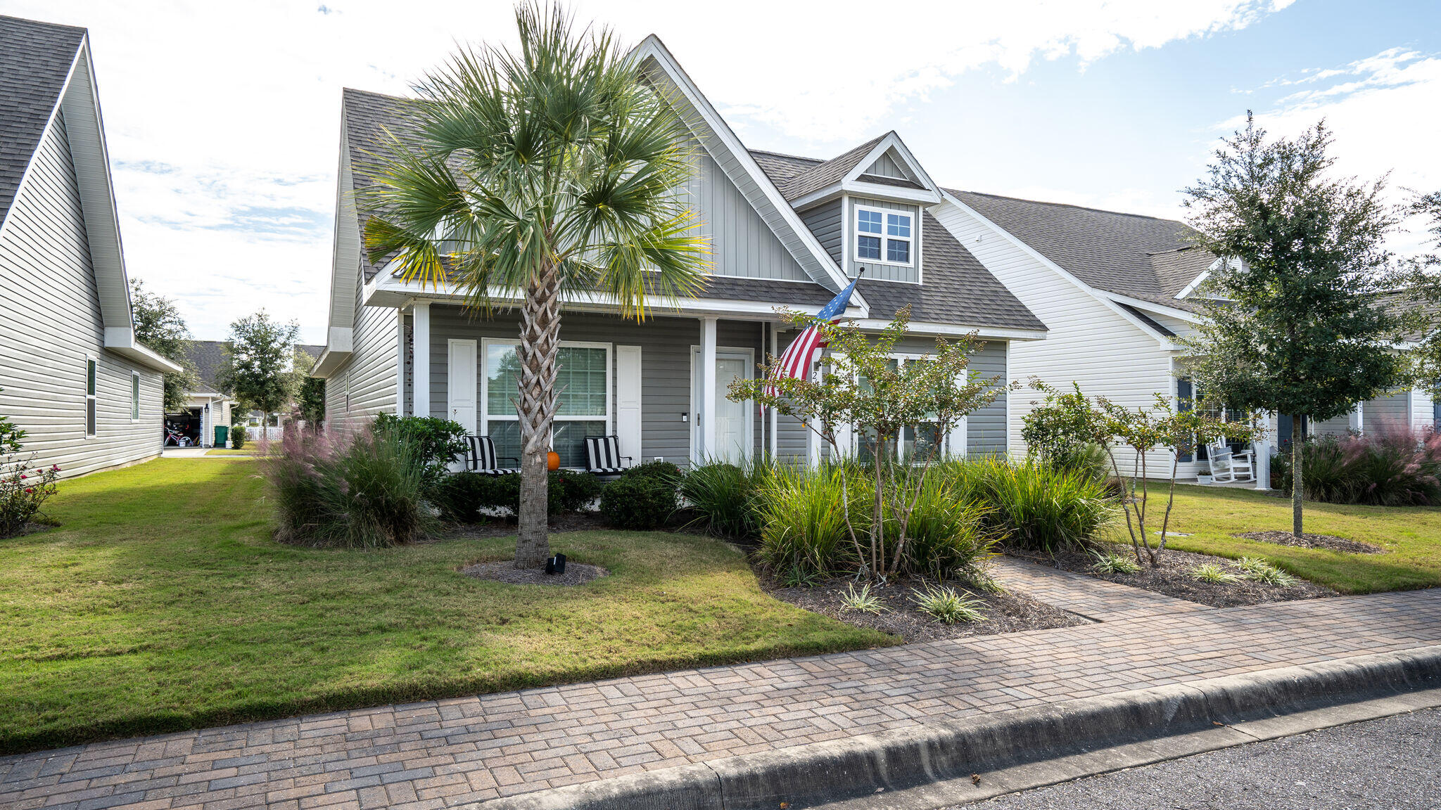 260 Cornelia Street Freeport, FL 32439 - Photo 4 of 42 a front view of a house with garden