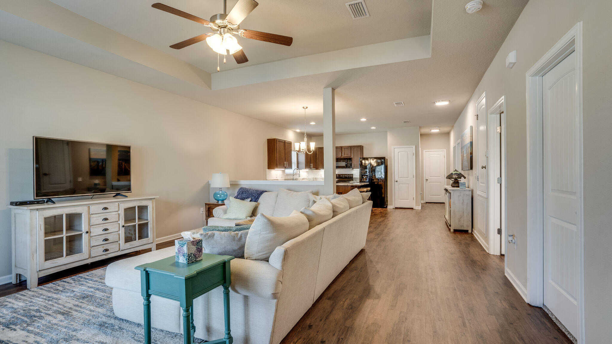 260 Cornelia Street Freeport, FL 32439 - Photo 5 of 42 a living room with furniture and a flat screen tv