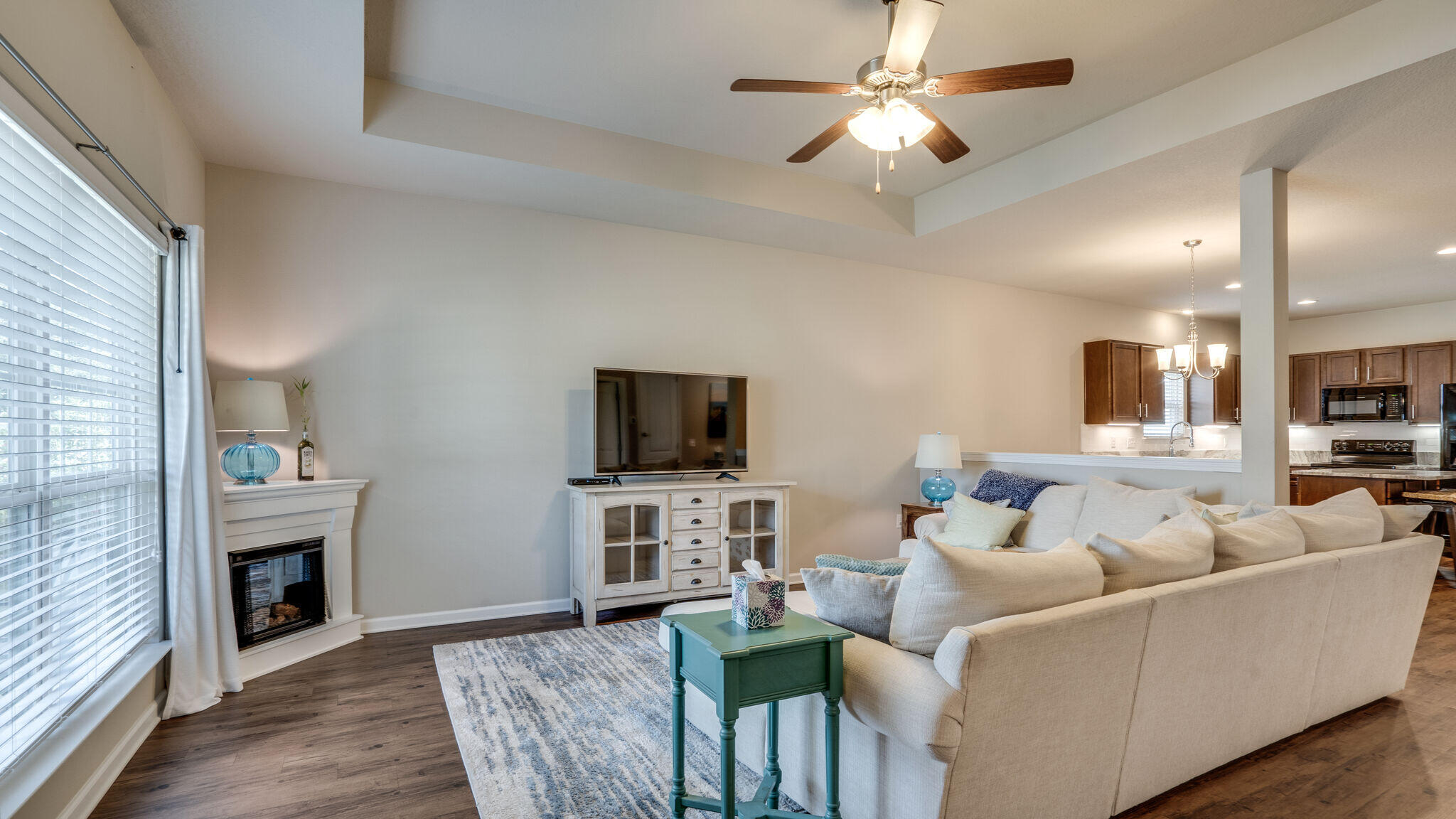 260 Cornelia Street Freeport, FL 32439 - Photo 7 of 42 a living room with furniture a fireplace and a flat screen tv
