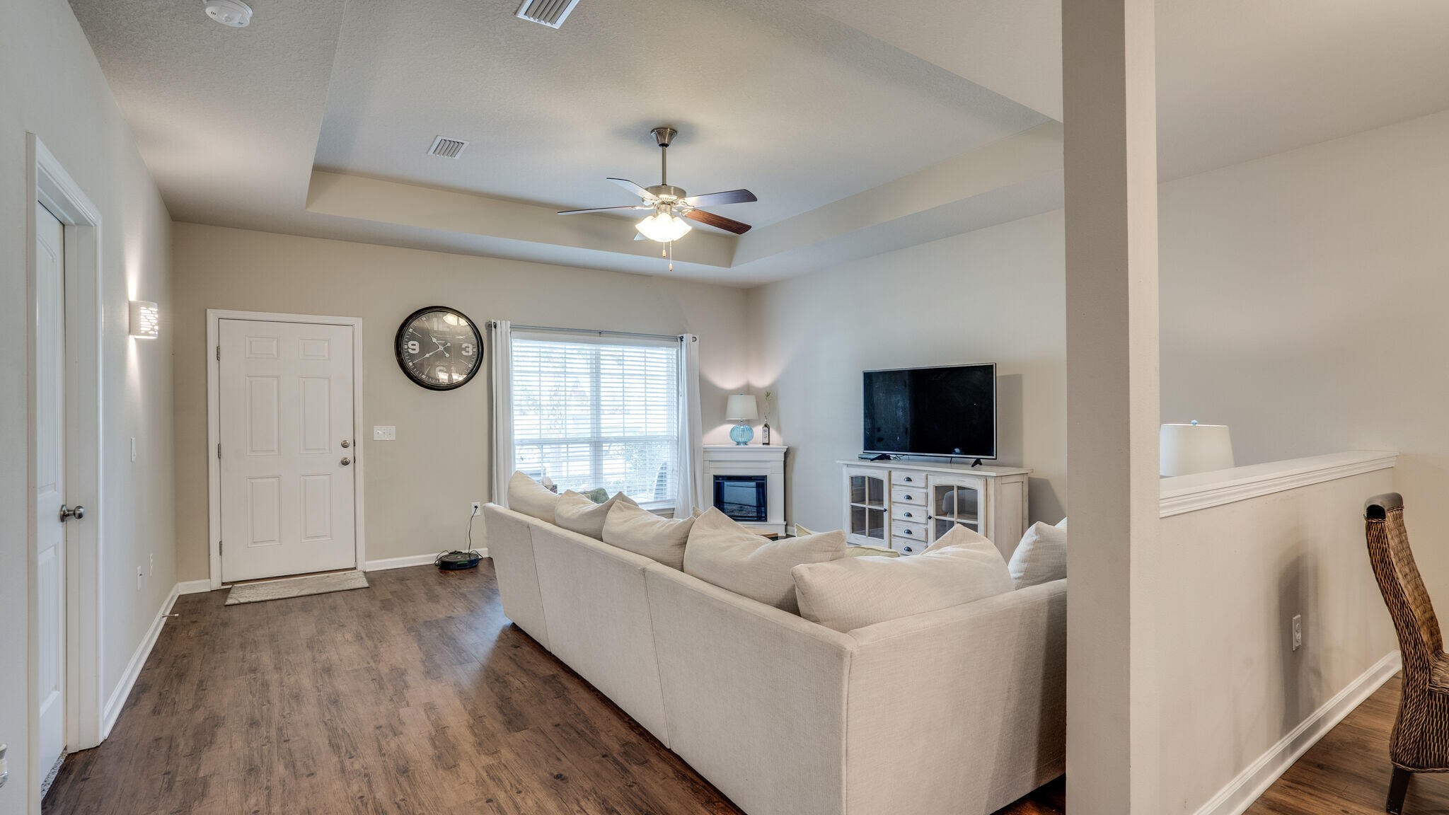 260 Cornelia Street Freeport, FL 32439 - Photo 8 of 42 a living room with furniture and a flat screen tv