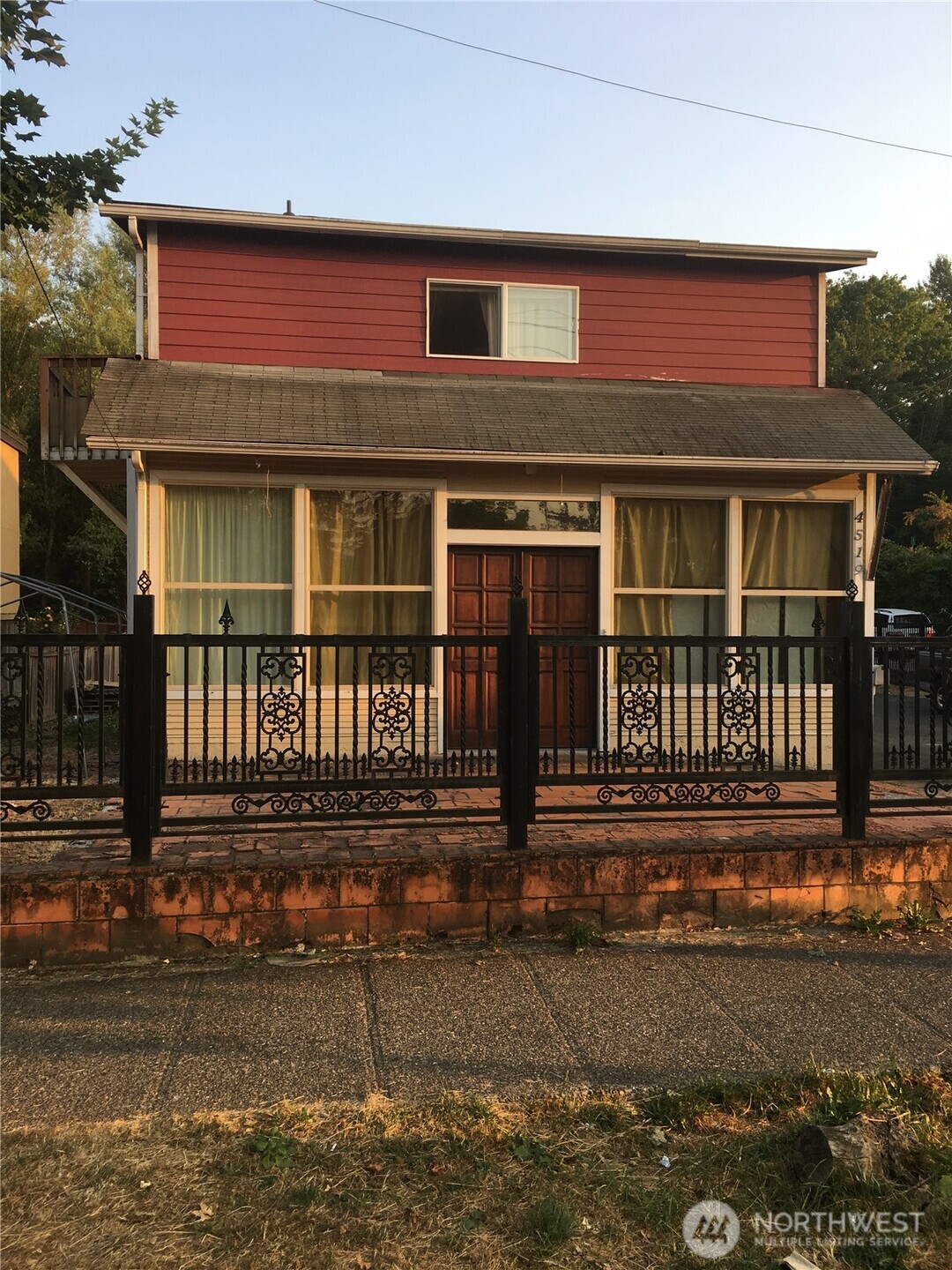 4519 South Henderson Street Seattle, WA 98118 - Photo 4 of 6 a front view of a house with street