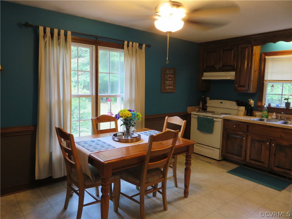 4097 Wakema Road West Point, VA 23181 - Photo 12 of 34 a dining room with a wooden table and chairs