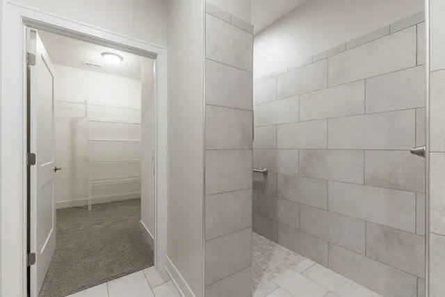 a bathroom with a shower and a bathtub