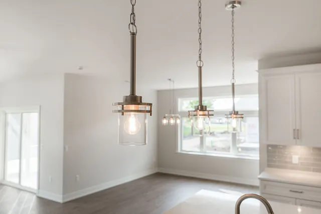 a view of an empty room with windows