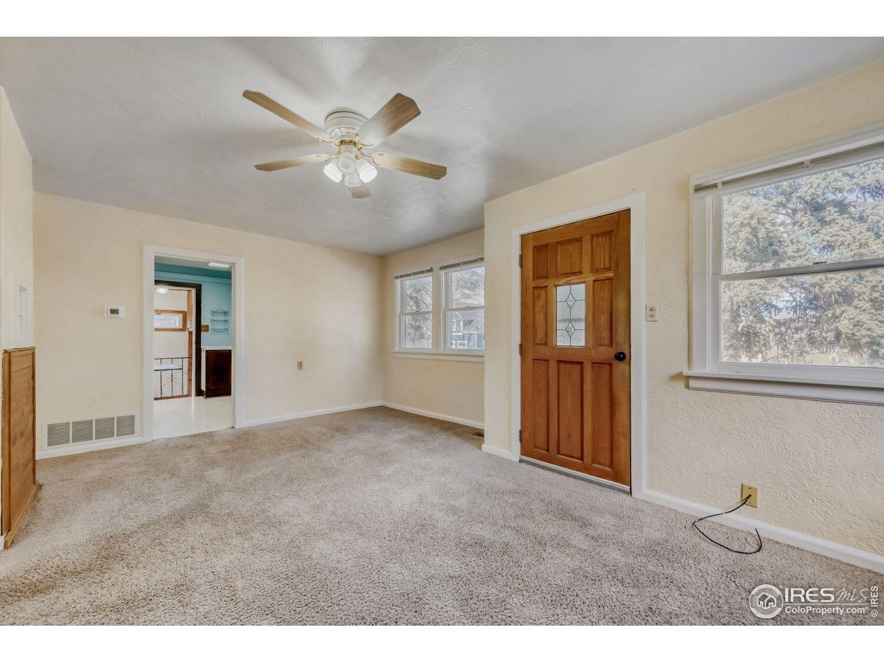 534 Dewey Avenue Boulder, CO 80304 - Photo 4 of 18 a view of an empty room with a window