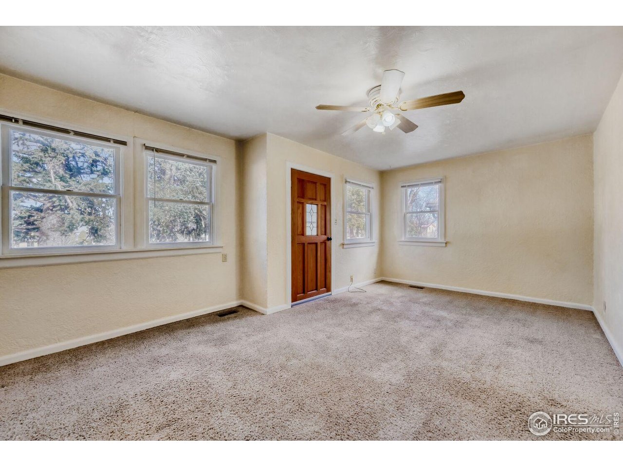 534 Dewey Avenue Boulder, CO 80304 - Photo 5 of 18 a view of an empty room with a window