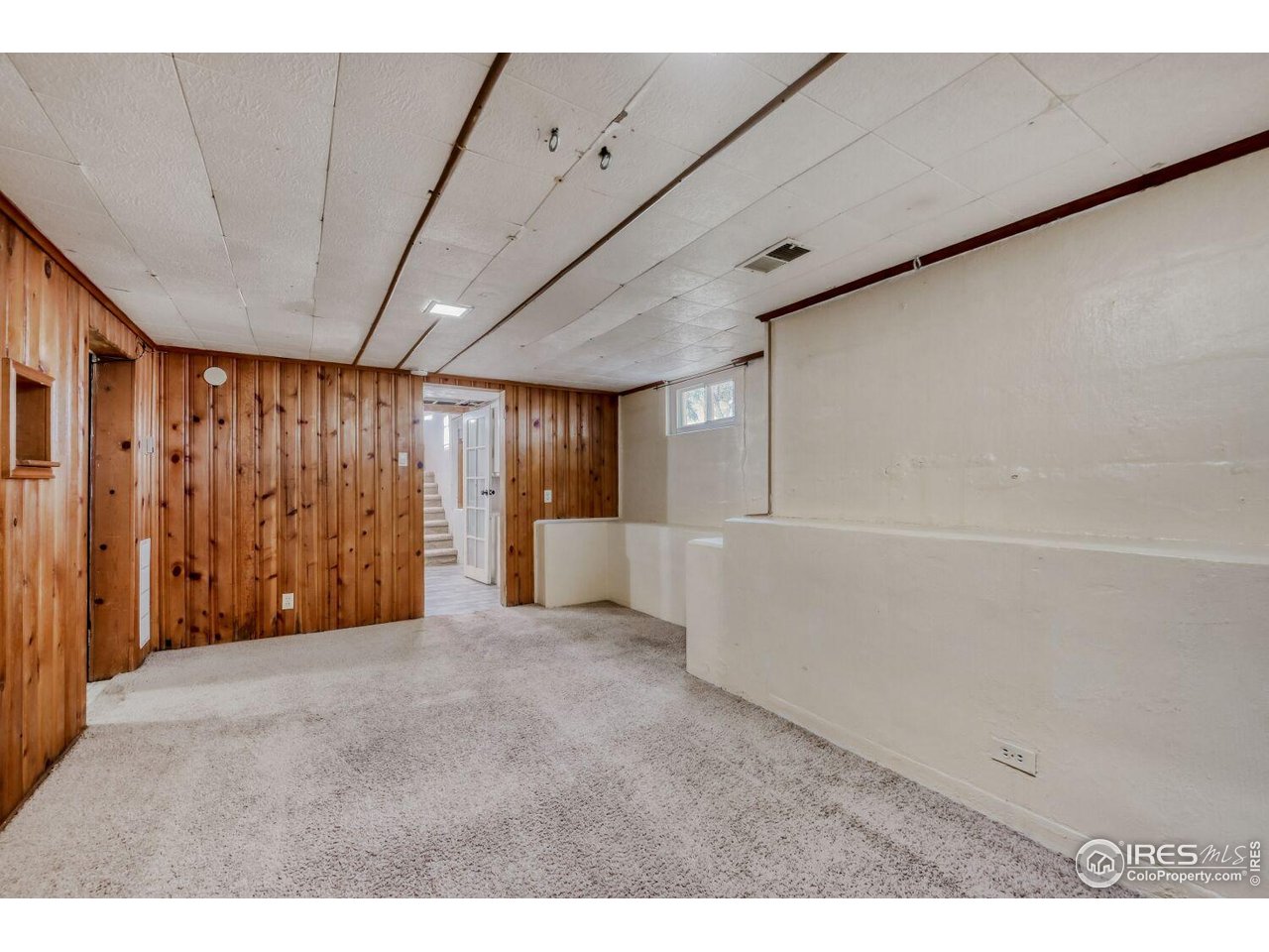 534 Dewey Avenue Boulder, CO 80304 - Photo 6 of 18 a view of an empty room with a window