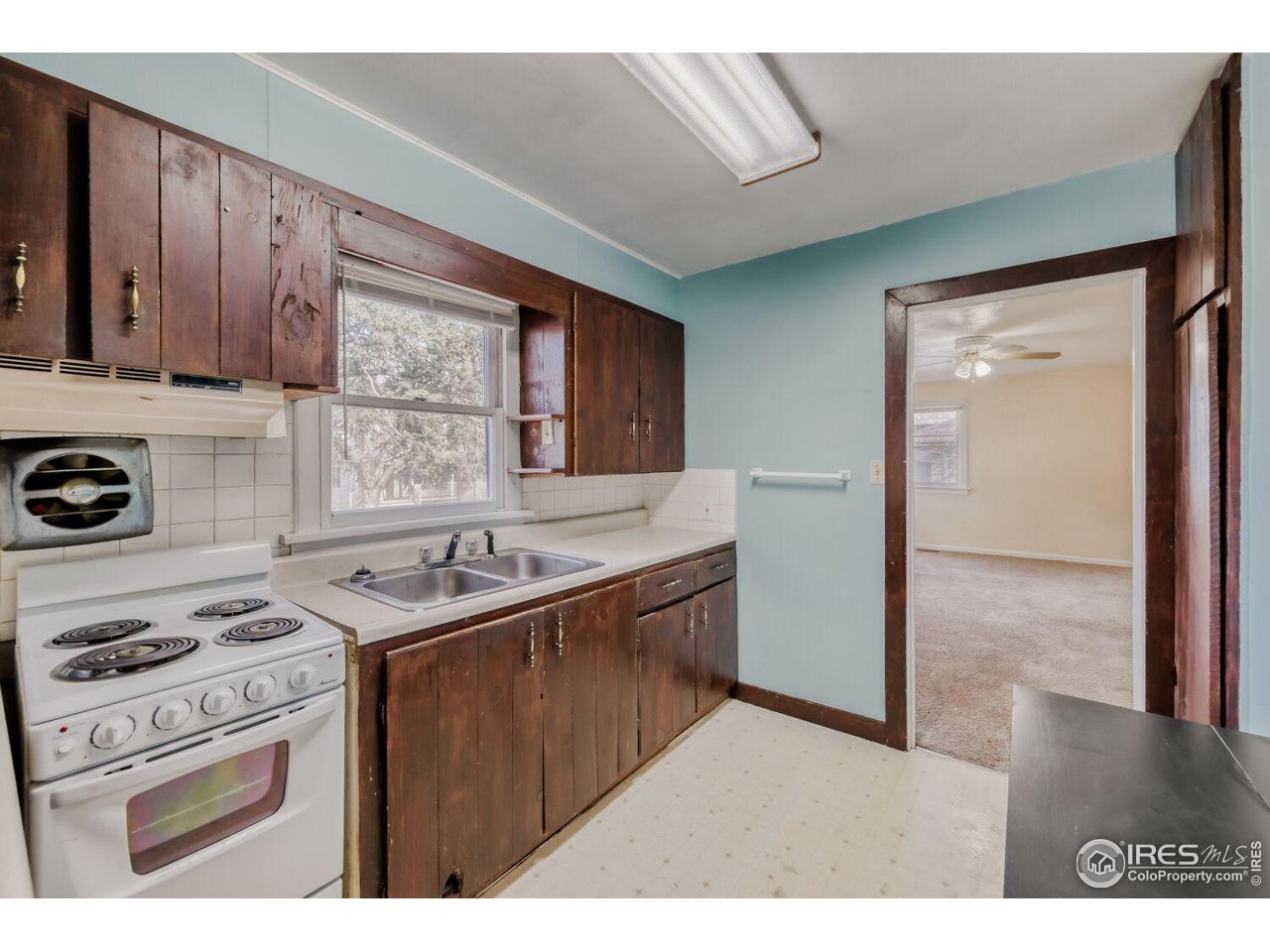 534 Dewey Avenue Boulder, CO 80304 - Photo 9 of 18 a kitchen with a stove and a sink