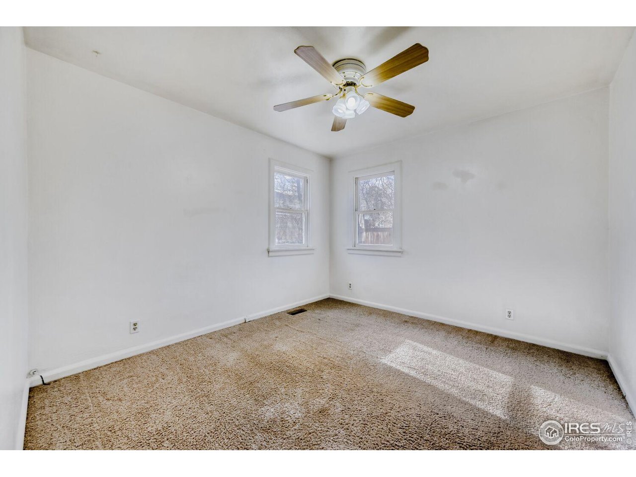 534 Dewey Avenue Boulder, CO 80304 - Photo 10 of 18 a view of an empty room with a window