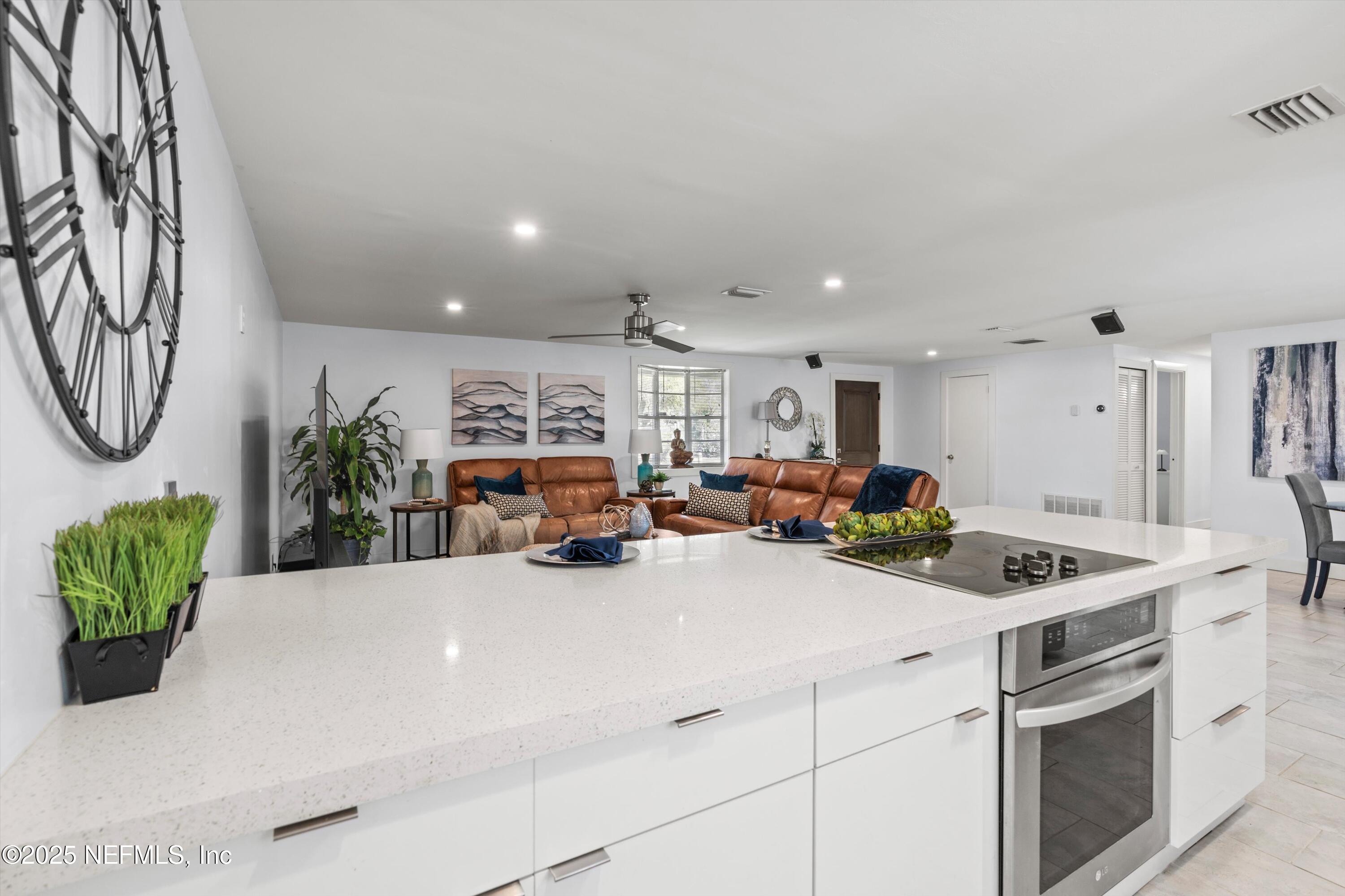 1216 Tumbleweed Drive Orange Park, FL 32065 - Photo 12 of 38 a kitchen with a sink and a stove top oven