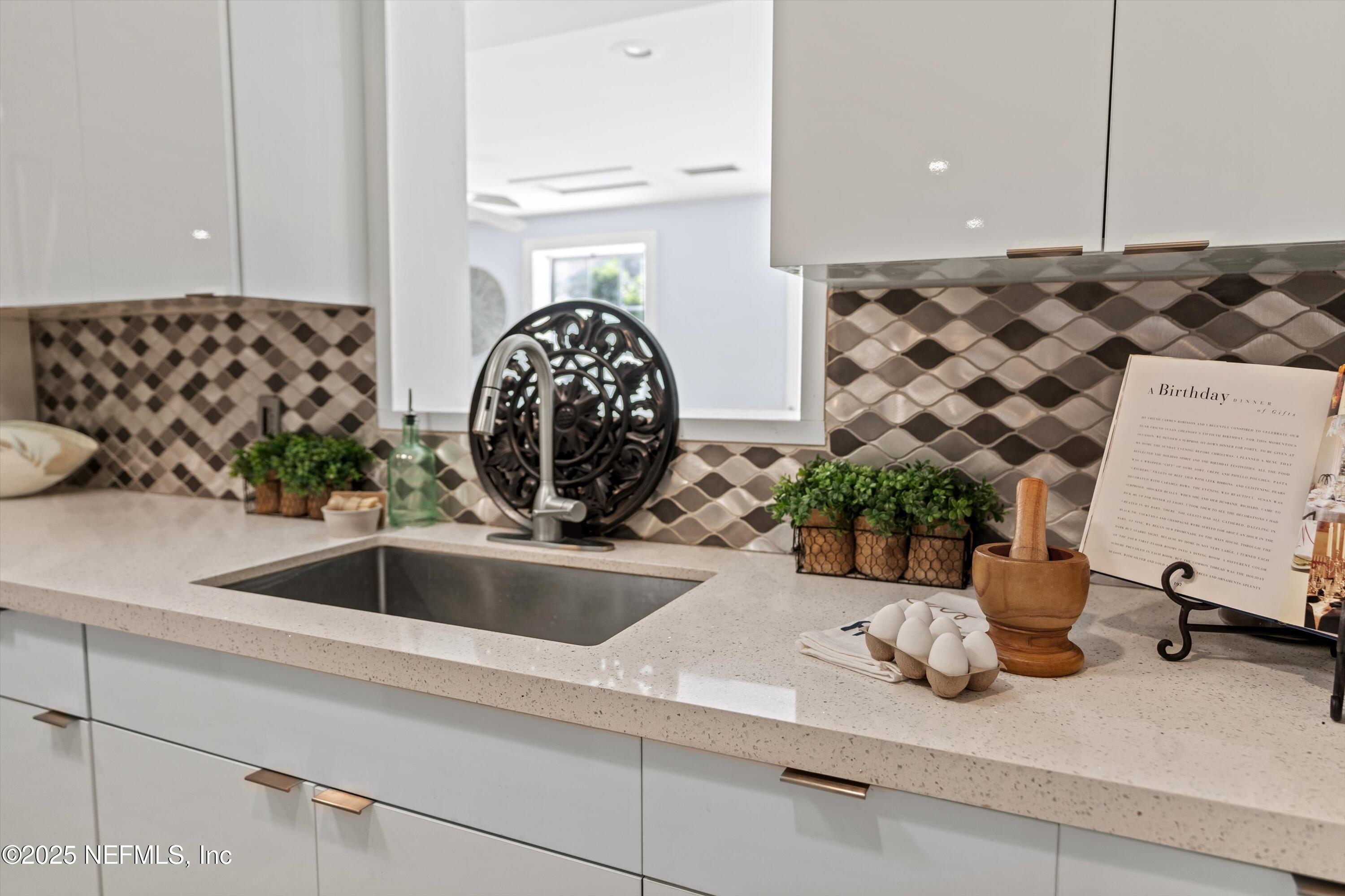1216 Tumbleweed Drive Orange Park, FL 32065 - Photo 13 of 38 a kitchen with a sink and a stove with wooden floor